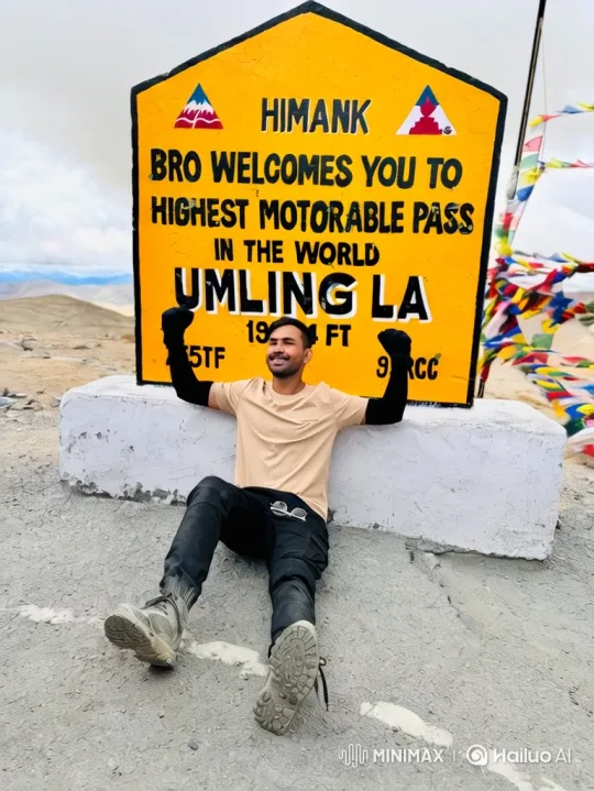 Young Man Celebrates Conquest of Umling La, World's Highest Motorable Pass – AI Generated Video | Hailuo AI