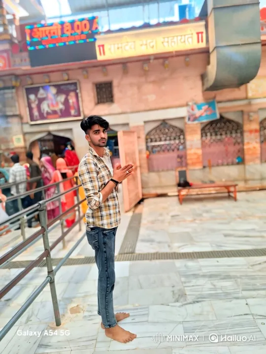 Young Man in Prayer Pose in Ornate Temple – AI Generated Video | Hailuo AI