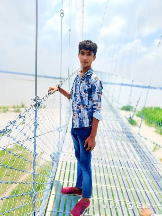 Young Man on Bridge: A Study in Calm and Nature – AI Generated Video | Hailuo AI