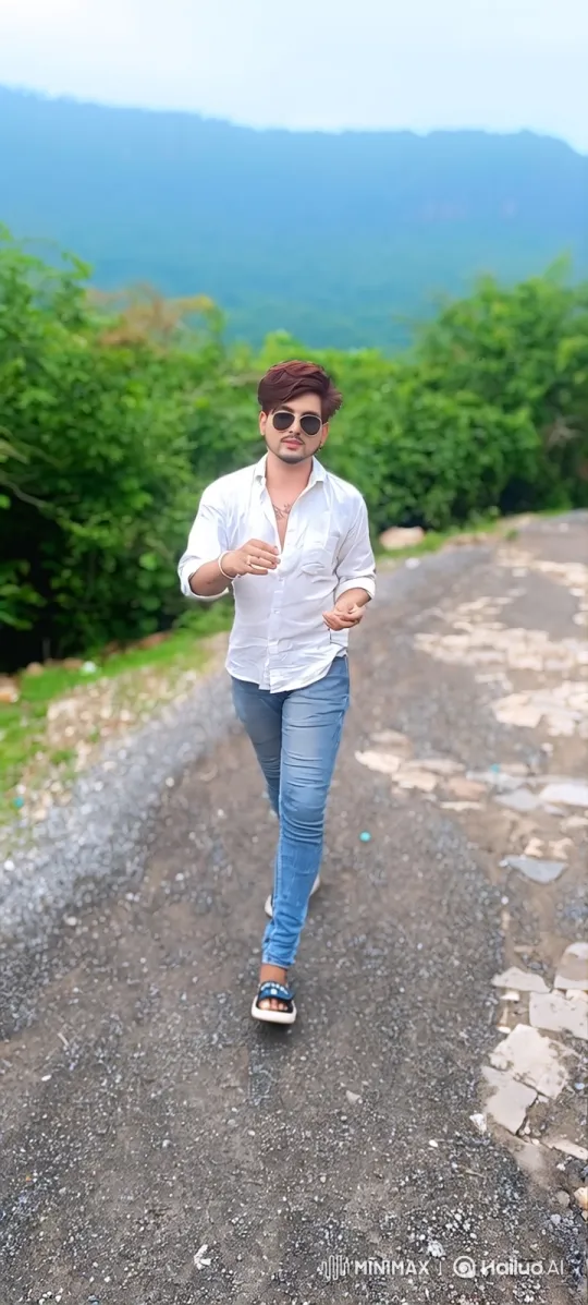 Confident Young Man Walks Through Scenic Landscape – AI Generated Video | Hailuo AI