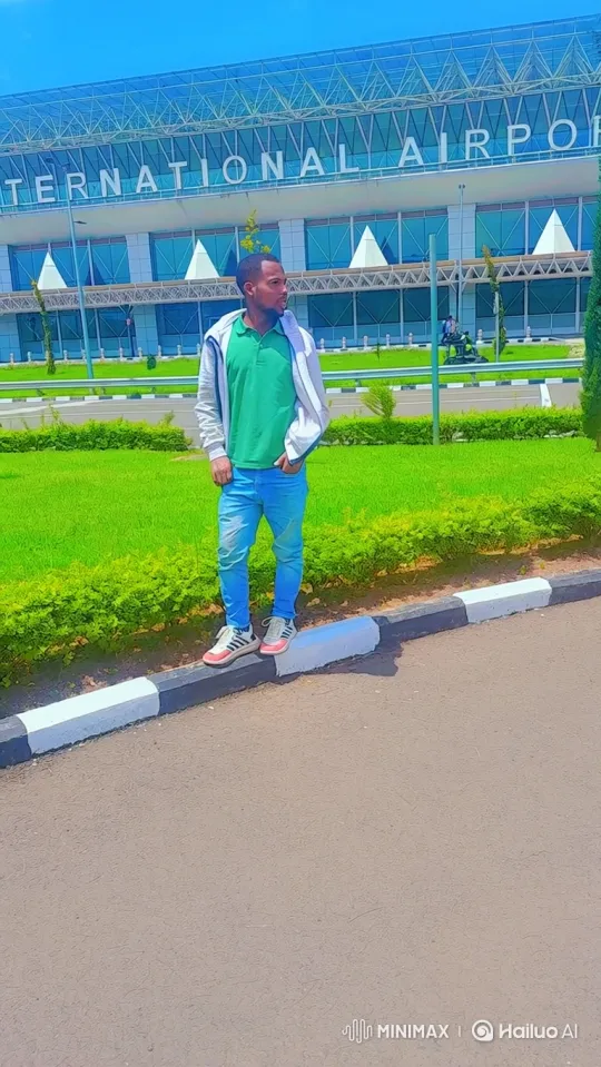 Man on Airport Sidewalk Smiles, Walks Away – AI Generated Video | Hailuo AI