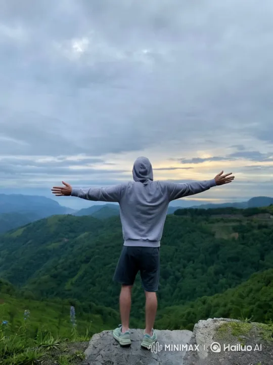 Contemplative Person Amidst Serene Hillscape – AI Generated Video | Hailuo AI
