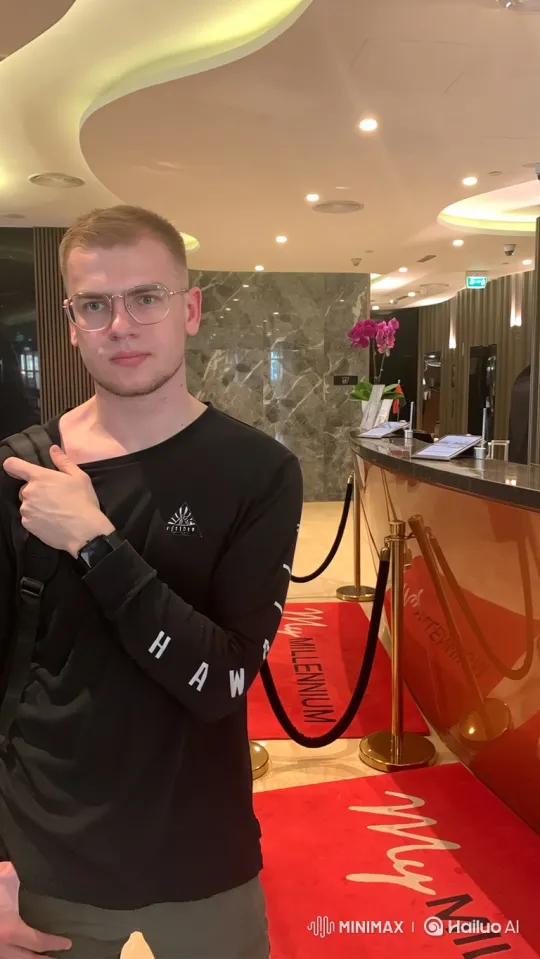 Young Man Waiting in Brightly Lit Hotel Lobby – AI Generated Video | Hailuo AI