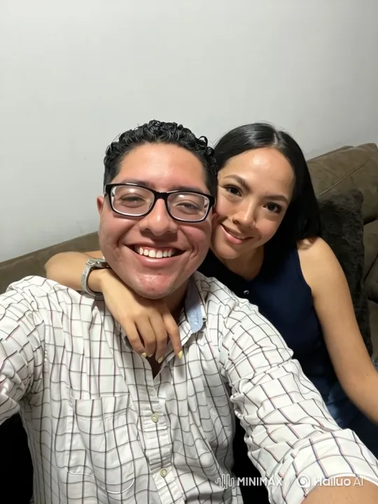 Young Family Embraces in Cozy Room – AI Generated Video | Hailuo AI