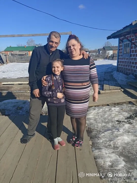 Family Embraces in Sunny Village Setting – AI Generated Video | Hailuo AI
