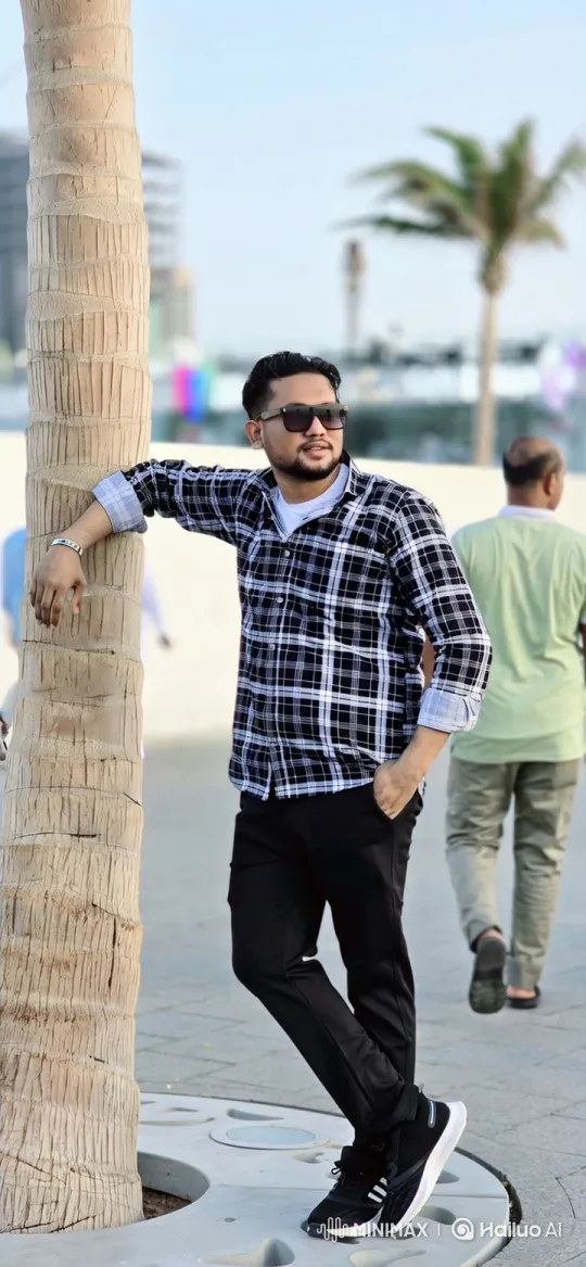 Man Stands by Palm Tree, Observes Surroundings – AI Generated Video | Hailuo AI
