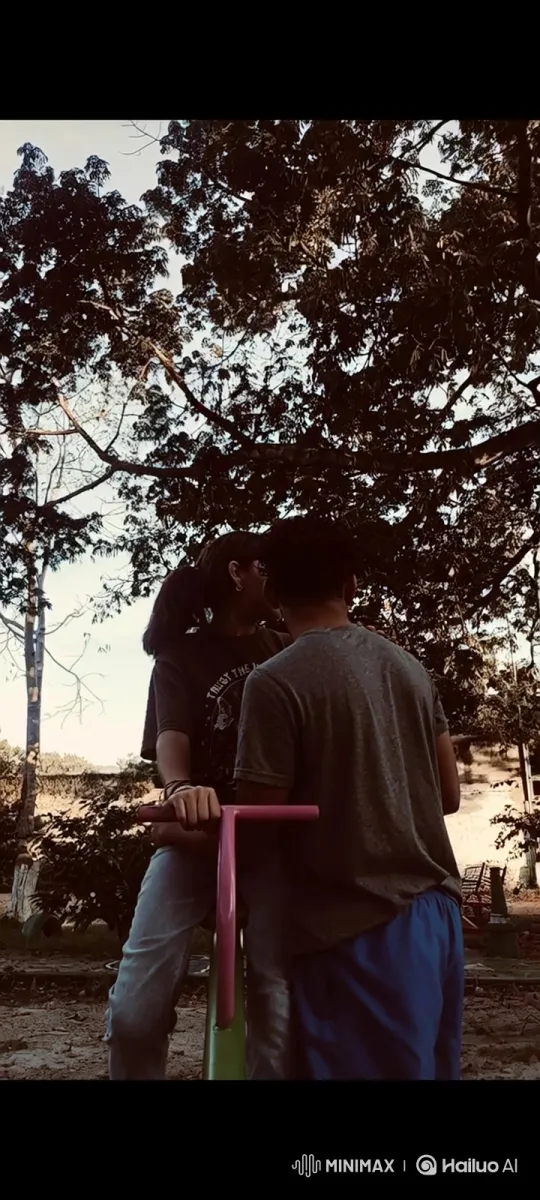 Family Embraces in Park at Sunset – AI Generated Video | Hailuo AI