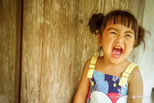 Young Girl's Joyful Expression and Walk Across Frame – AI Generated Video | Hailuo AI