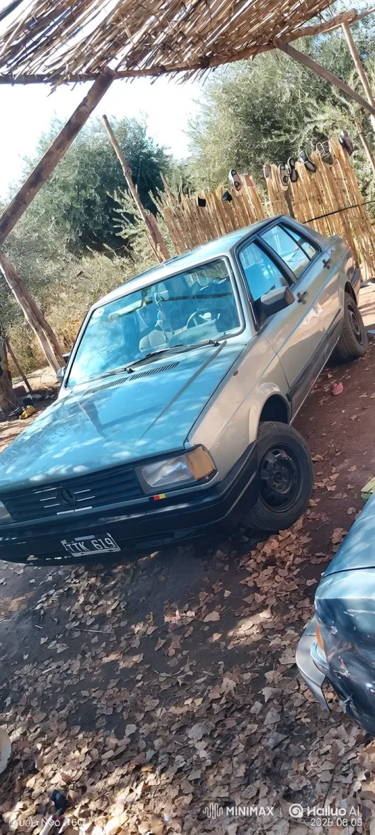 Silver Sedan Lowering on Dirt Lot with Rustic Shelter – AI Generated Video | Hailuo AI
