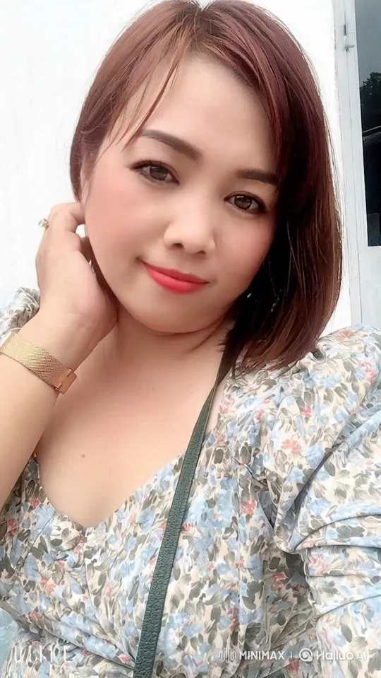 Woman with Floral Blouse and Gentle Smile – AI Generated Video | Hailuo AI