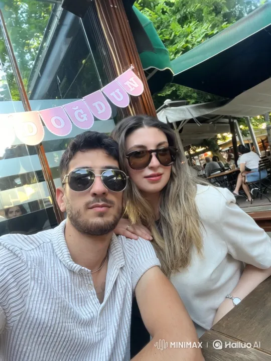 Family Embrace in Summer Café Setting – AI Generated Video | Hailuo AI