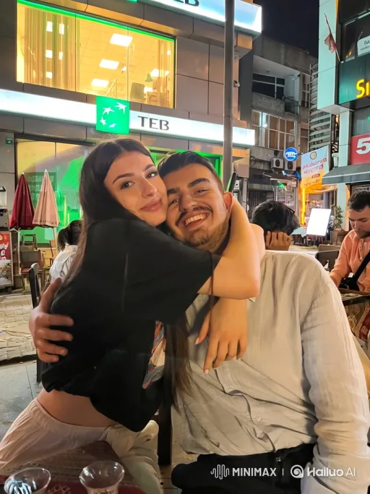 Family Embrace Captured in Nighttime Cafe Scene – AI Generated Video | Hailuo AI