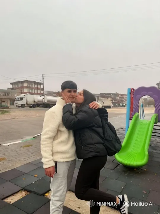 Affectionate Family Moment in Playground Setting – AI Generated Video | Hailuo AI