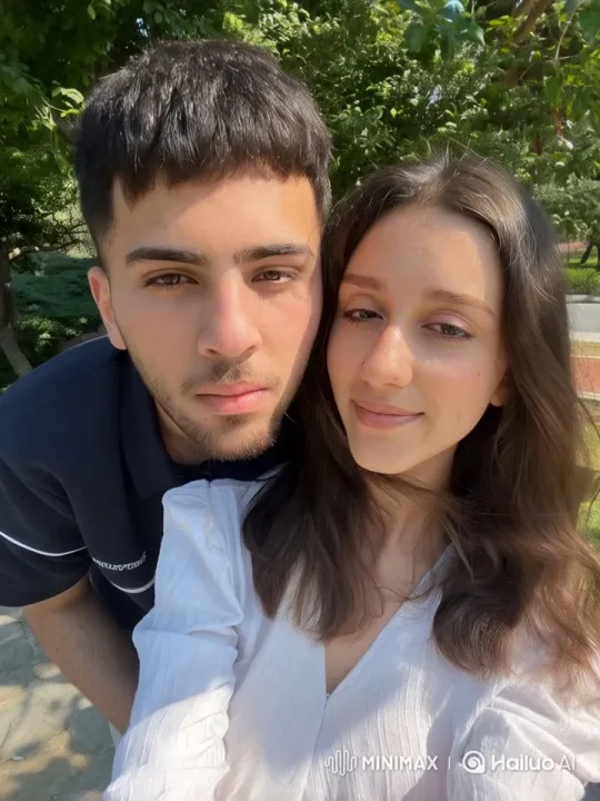 Young Friends Embrace in Scenic Outdoor Setting – AI Generated Video | Hailuo AI