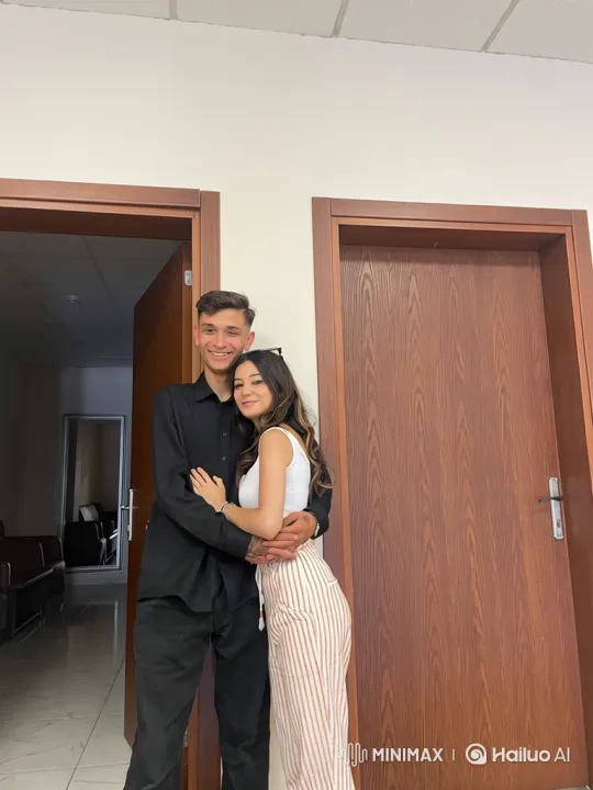 Family Embrace Captured in Sunlit Park Video – AI Generated Video | Hailuo AI