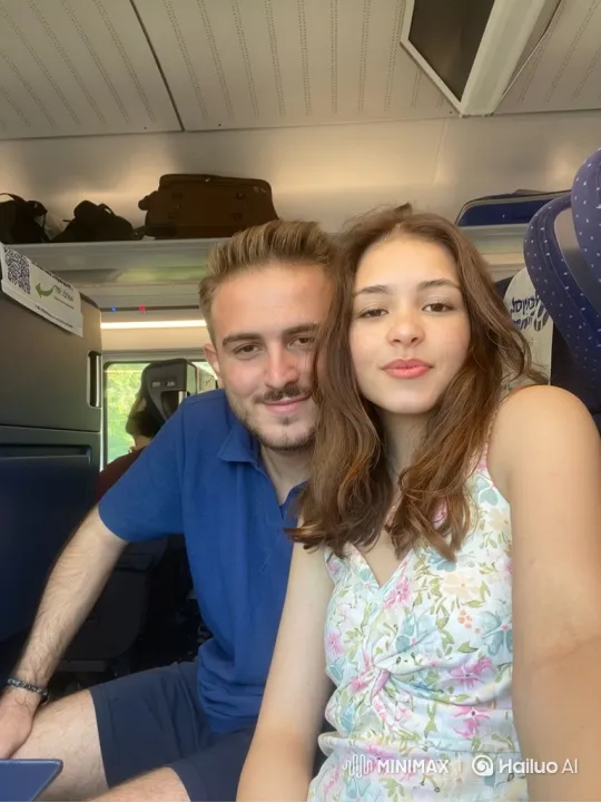 Family Moment on a Train: Young Couple and Little Girl – AI Generated Video | Hailuo AI