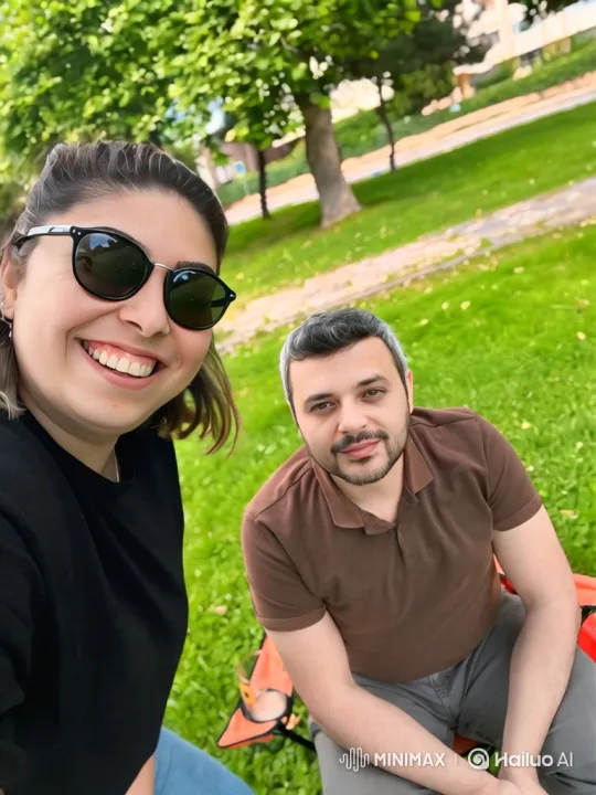Young Family Embraces in Dusk-Lit Park – AI Generated Video | Hailuo AI