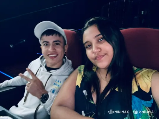 Young Family Enjoying a Movie in a Cozy Theater – AI Generated Video | Hailuo AI