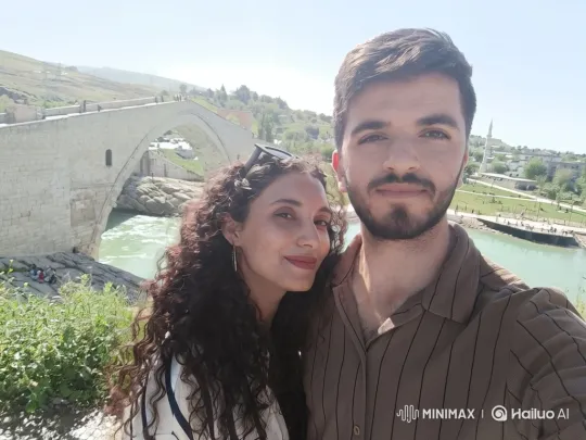 Family Reunion at Scenic Bridge with Loving Embrace – AI Generated Video | Hailuo AI