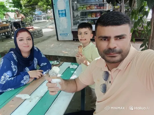 Family Embrace Captured in Park Setting – AI Generated Video | Hailuo AI