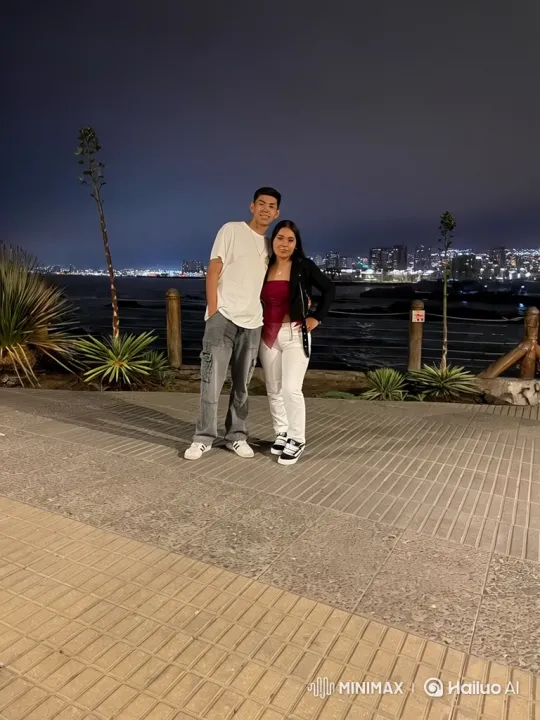 Family Embrace Captured in Nighttime Cityscape – AI Generated Video | Hailuo AI