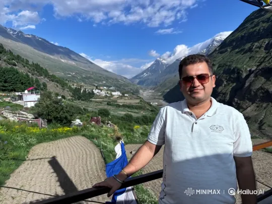 Man Enjoying Serene Mountain Valley with Gentle Smile – AI Generated Video | Hailuo AI