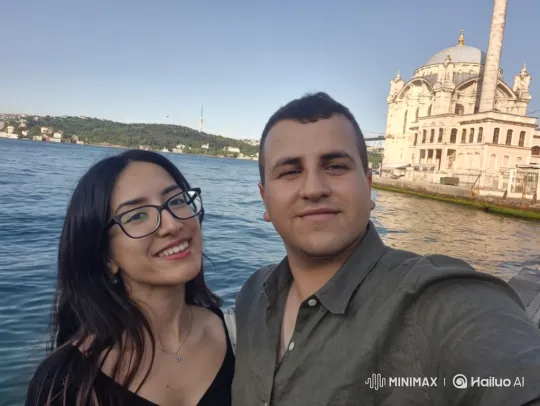 Family Embrace by Blue Water with Mosque Background – AI Generated Video | Hailuo AI