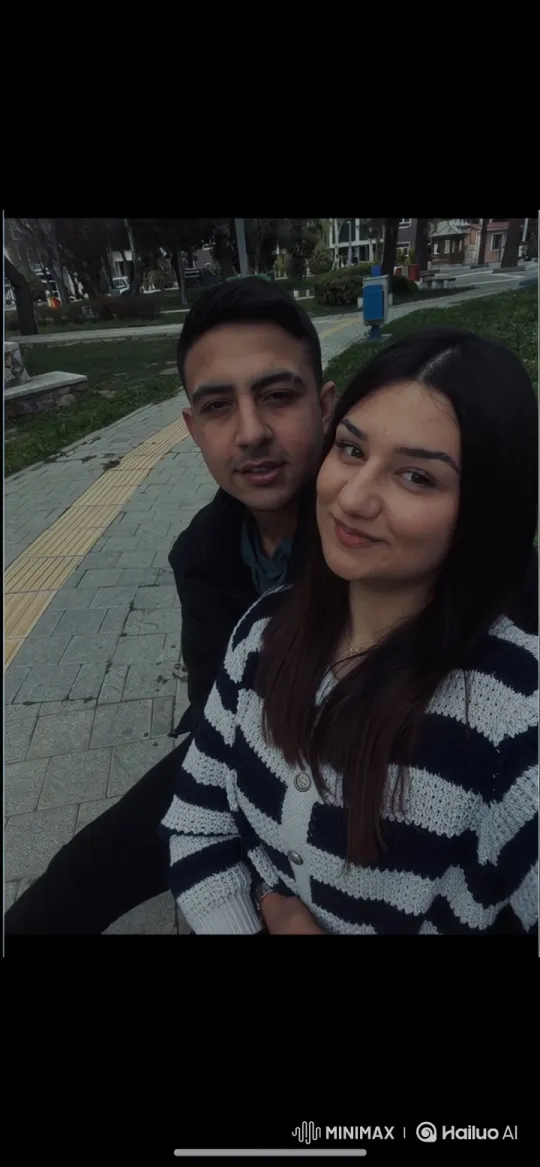 Family Embrace Captured in Winter Park Scene – AI Generated Video | Hailuo AI
