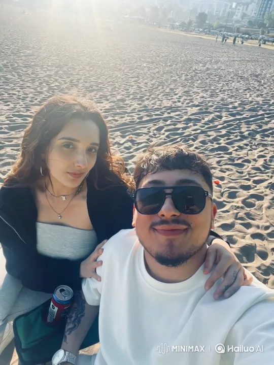 Young Family Embraces on Sandy Beach During Summer Evening – AI Generated Video | Hailuo AI