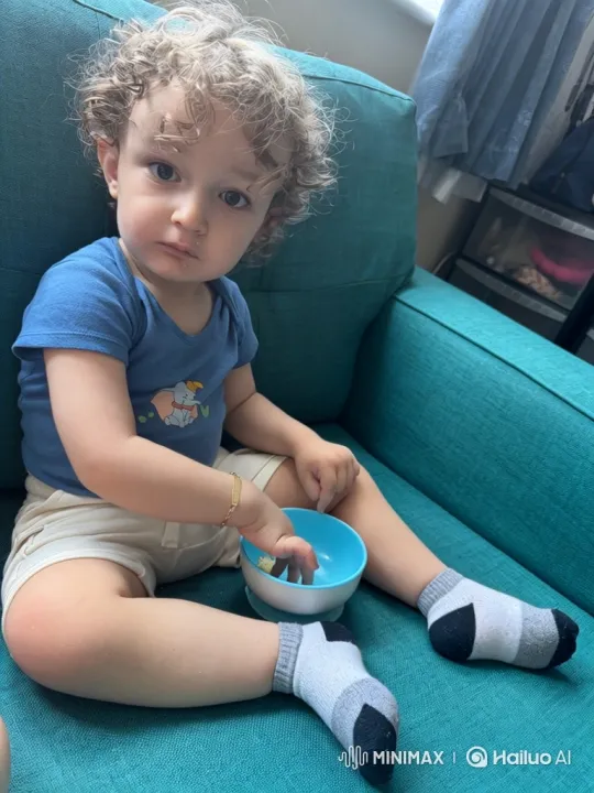 Toddler Eating Cereal with Focused Expression – AI Generated Video | Hailuo AI
