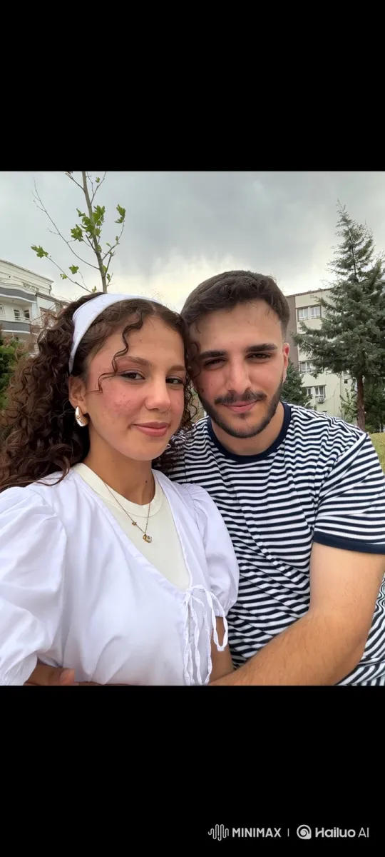 Family Embrace in the Park on a Cloudy Day – AI Generated Video | Hailuo AI
