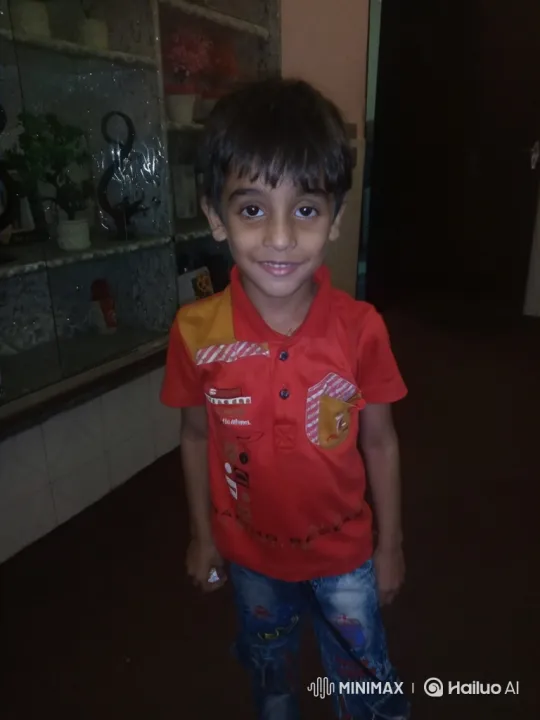 Boy's Grin and Gentle Movement in Subdued Light – AI Generated Video | Hailuo AI