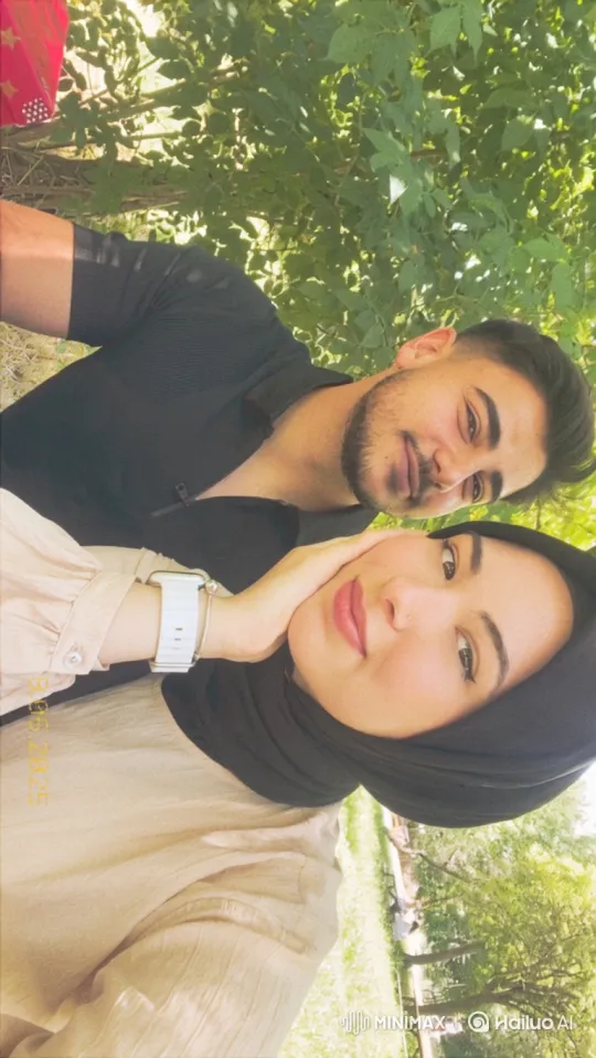 Young Family Embraces in Park at Evening – AI Generated Video | Hailuo AI