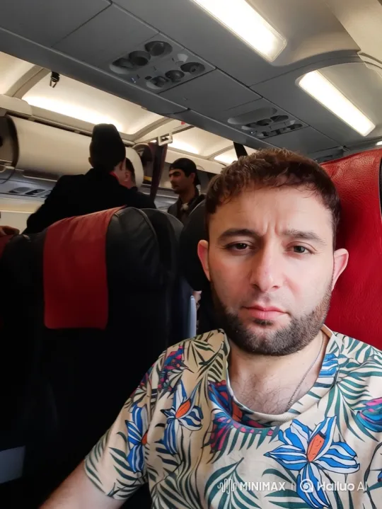 Passenger Receives Coffee from Flight Attendant on Plane – AI Generated Video | Hailuo AI