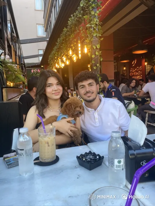 Young Couple and Daughter Embrace at Outdoor Café – AI Generated Video | Hailuo AI