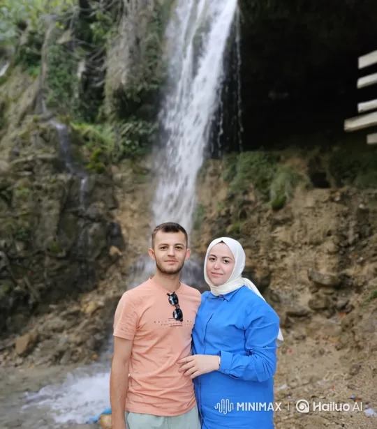 Family Embraces by Waterfall: Candid Summer Moment – AI Generated Video | Hailuo AI