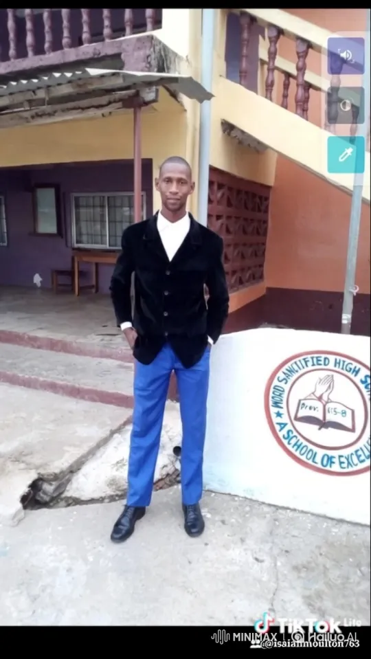 Confident Young Man in Velvet Blazer Amidst Schoolyard – AI Generated Video | Hailuo AI