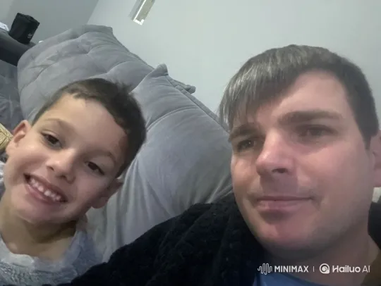 Man and Boy Share Affectionate Moment – AI Generated Video | Hailuo AI