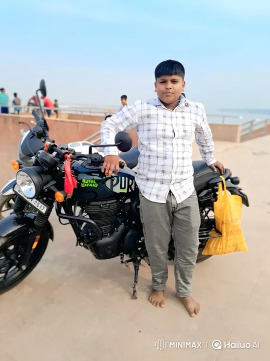 Young Boy Poses by Motorcycle at Waterfront – AI Generated Video | Hailuo AI