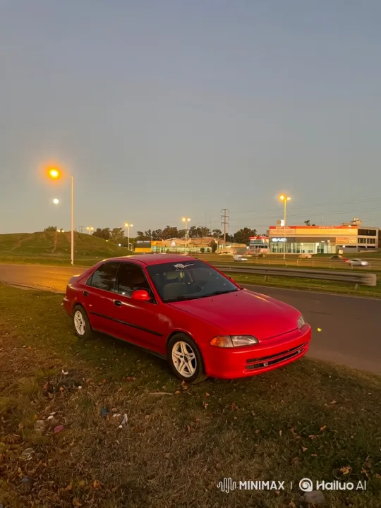 Red Sedan Lowers on Grass Slope at Dusk – AI Generated Video | Hailuo AI