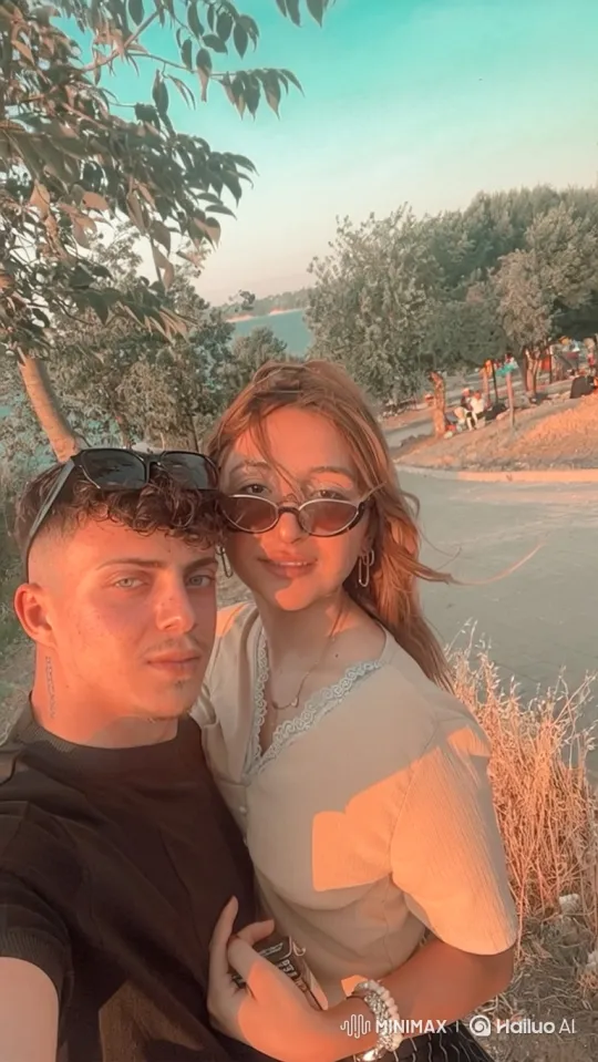 Young Family Embraces in Golden-Hour Park Scene – AI Generated Video | Hailuo AI