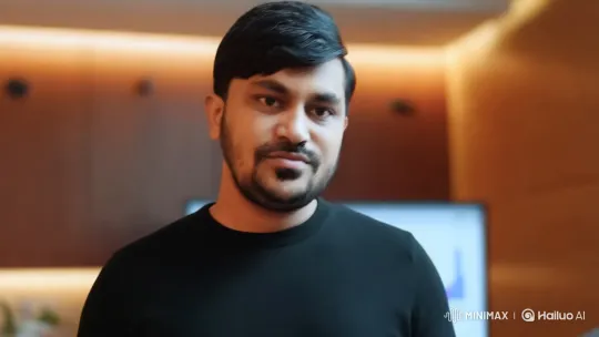Professional Man Presenting in Modern Office Setting – AI Generated Video | Hailuo AI