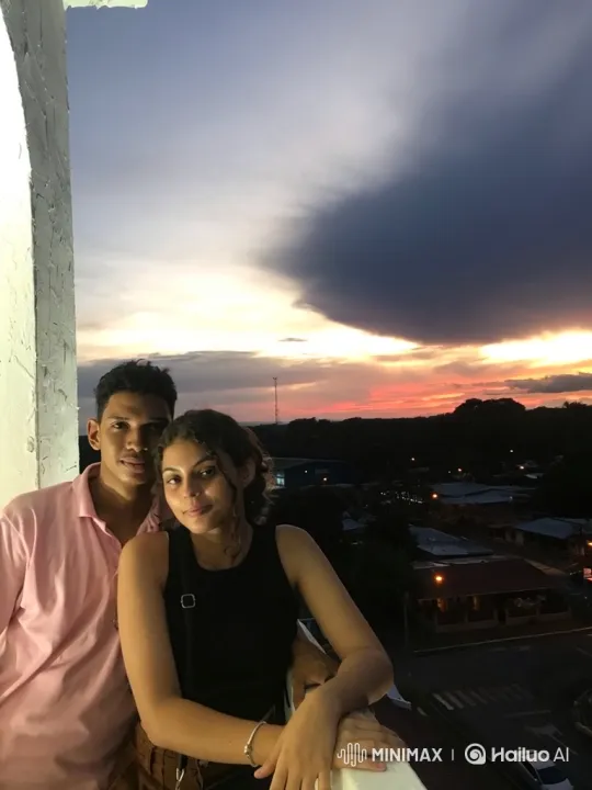 Family Embrace on Balcony at Twilight – AI Generated Video | Hailuo AI