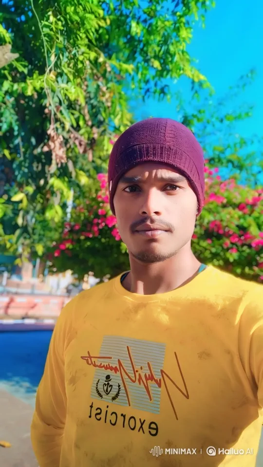 Young Man Smiles Gently in Sunny Outdoor Setting – AI Generated Video | Hailuo AI