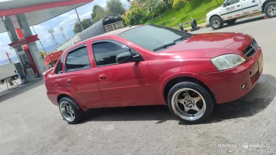 Red Sedan Lowering Its Suspension on Asphalt Lot – AI Generated Video | Hailuo AI