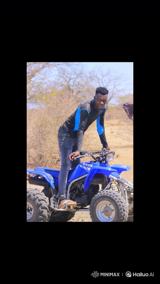 Young Man Prepares to Ride ATV in Dry Landscape – AI Generated Video | Hailuo AI