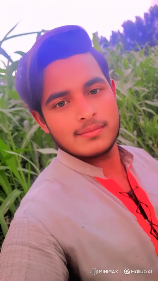 Young Man in Field with Gentle Smile and Swaying Plants – AI Generated Video | Hailuo AI