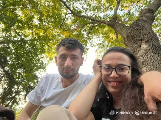 Family Embrace Under a Summer Tree – AI Generated Video | Hailuo AI