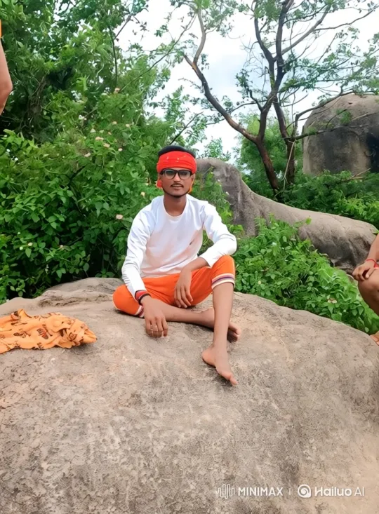 Man on Rock Amidst Expansive Landscape – AI Generated Video | Hailuo AI
