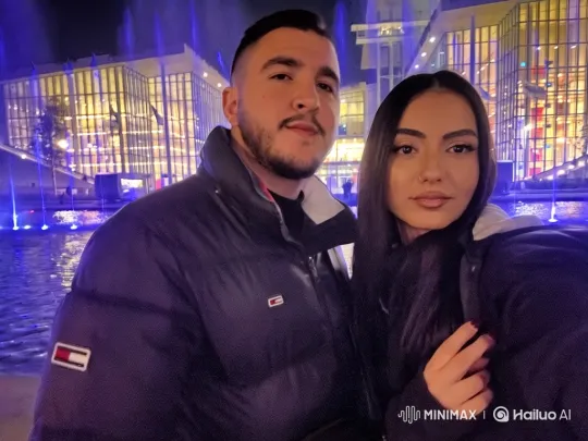 Family Enjoying a Nighttime Selfie by a Fountain – AI Generated Video | Hailuo AI